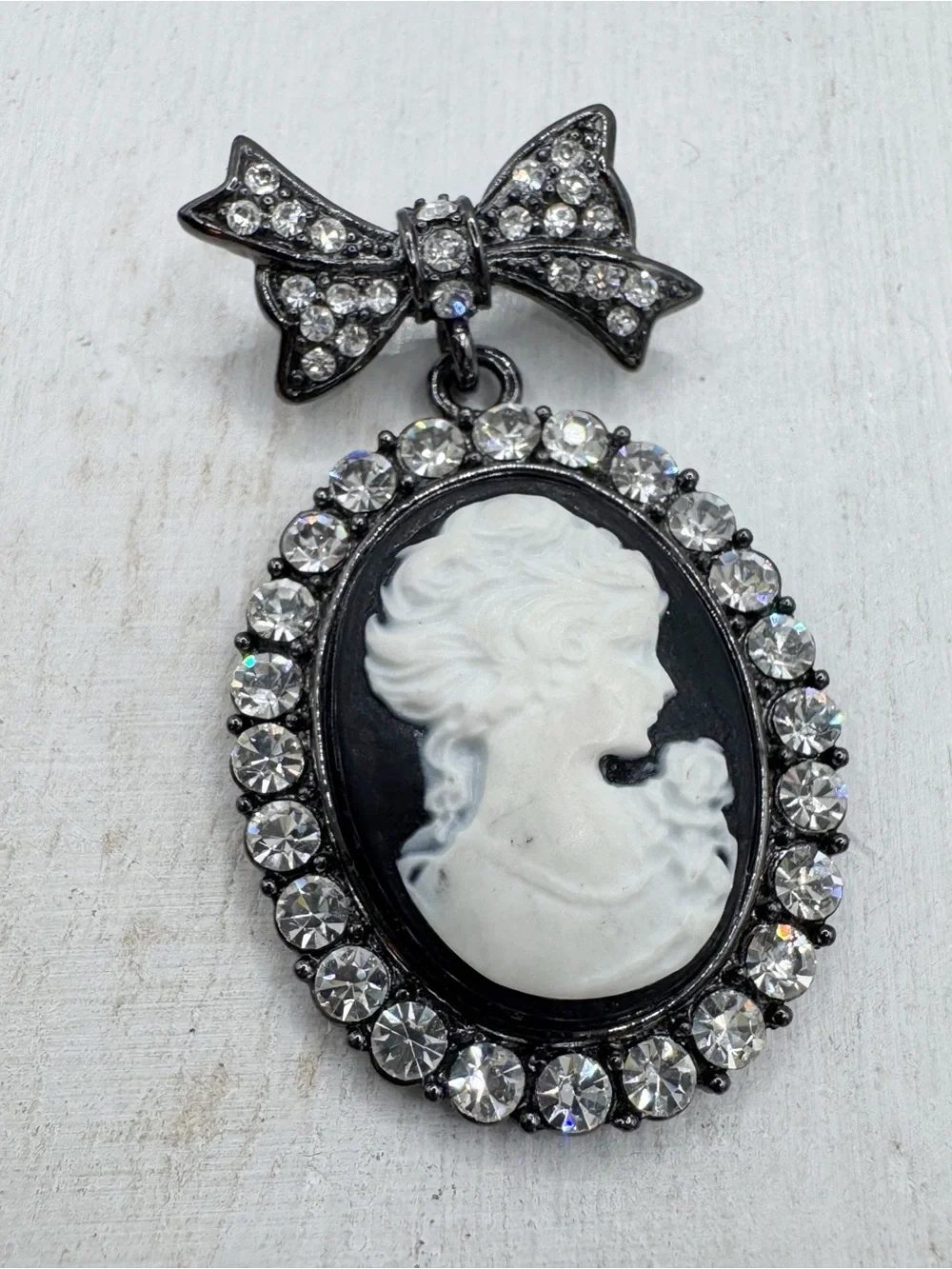 Vintage Victorian revival cameo bow brooch pin black white